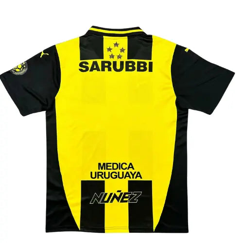 camisa peñarol 2025, camisa aurinegra, escudo bordado peñarol, uniforme torcedor uruguaio, manto peñarol listrado, futebol sul-americano